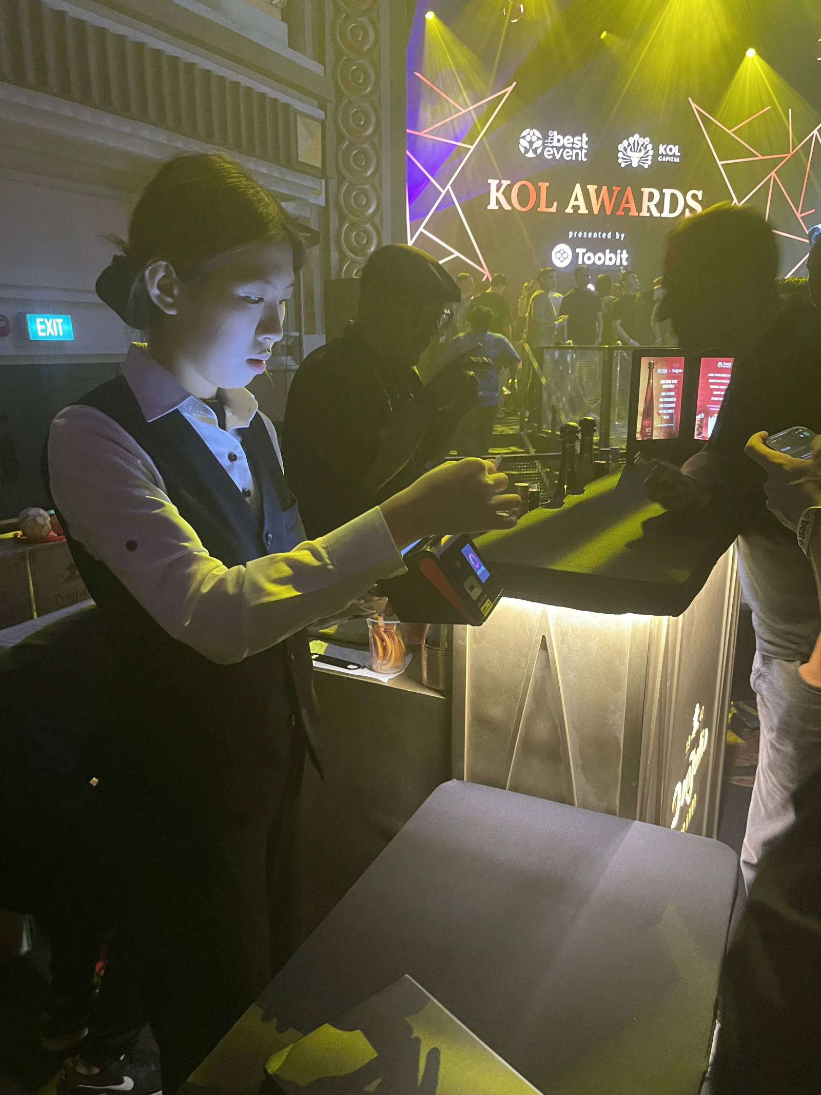 Cashier using a portable Rewardly P2 payment terminal during AFTERDARK at Capitol Theatre