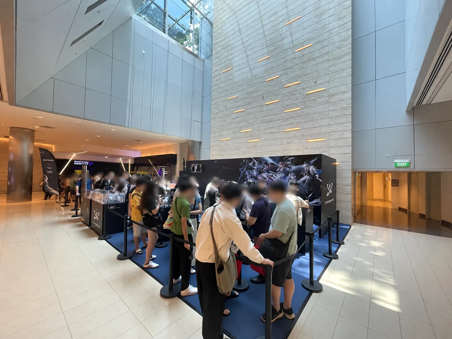 Managed crowd and merchandise queue at online video games CityLink Mall pop-up; faces obscured